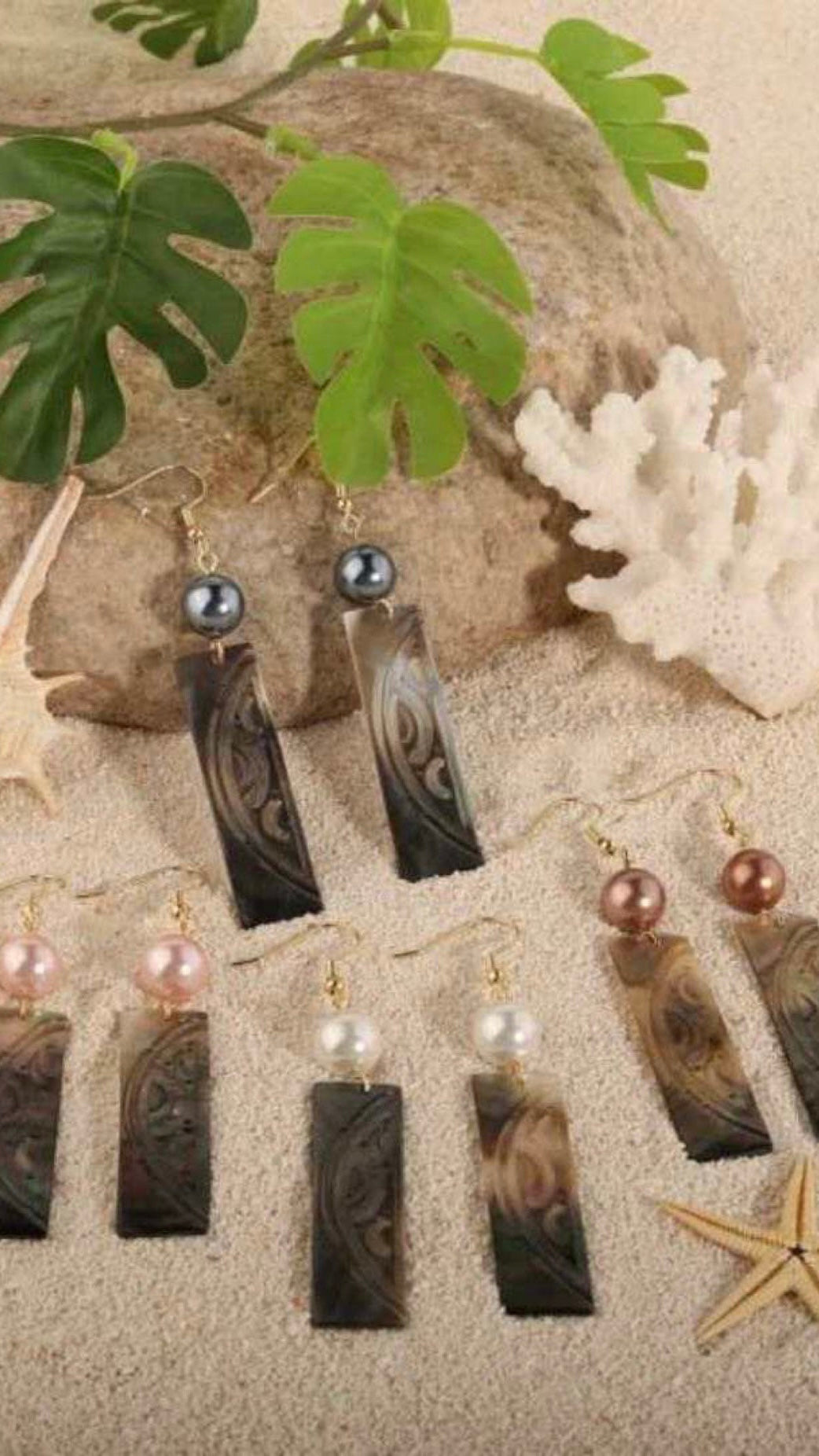 Carved mop stick earrings